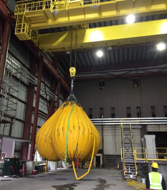 Proof load and function testing of new 60 ton crane in steel mill.
