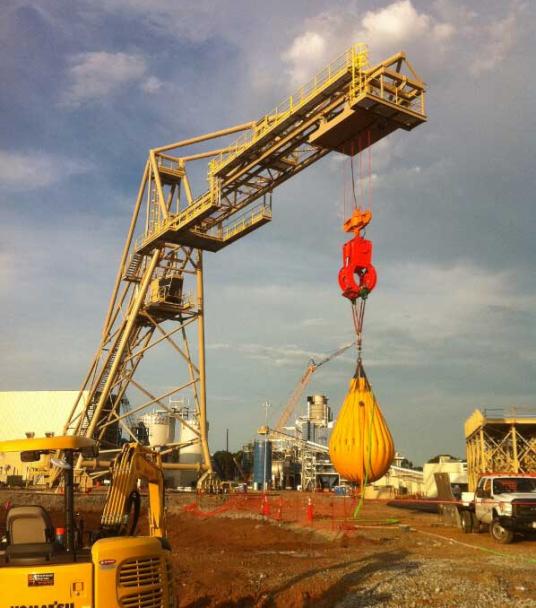 Proof load testing new logging crane to 25 tons during commissioning.