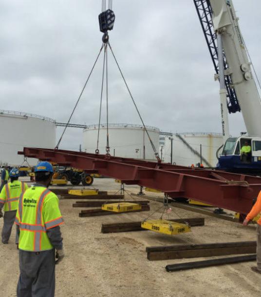 Proof load testing pad-eyes on beam to 55,000 lbs prior to lifting bridge girders.