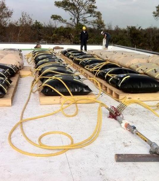 Proof Load Applied with Water Bags to Building Roofing System